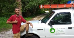 Marlon with his work truck giving a thumbs up